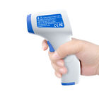 Mesure précise de thermomètre d'affichage de contact infrarouge tenu dans la main clair non